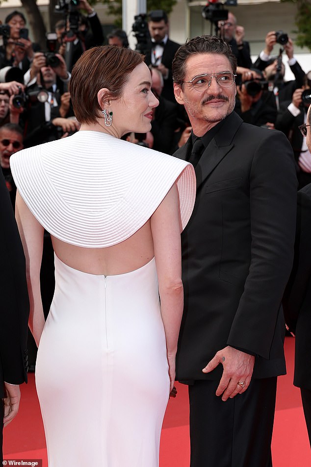 Emma flashed her toned physique in the backless number