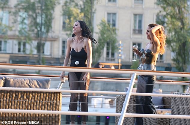 Katy put on an animated display as she laughed and joked with her gal pals