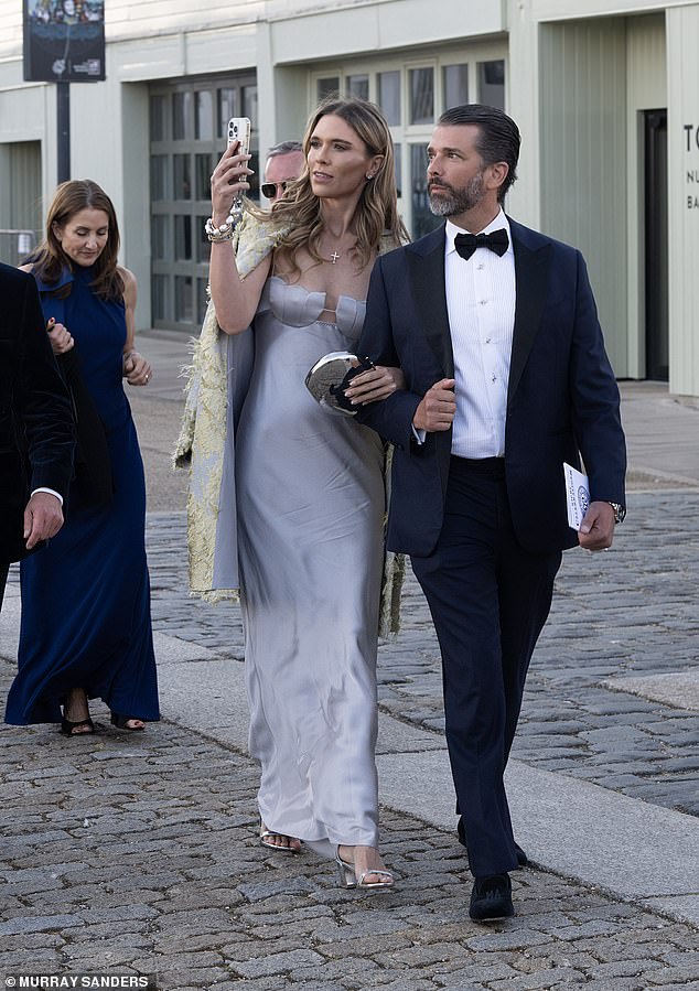Anderson takes an photo of Portsmouth city as she walks along the cobbled streets with her influential boyfriend