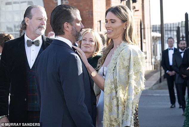 Anderson lovingly adjust Donald Jr bowtie ahead of the event on HMS Victory and HMS Warrior