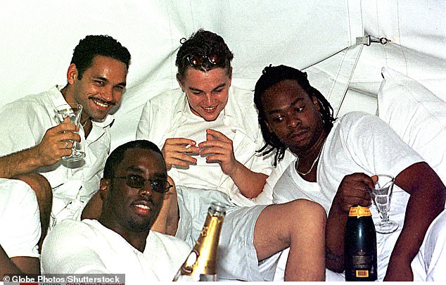 Combs revealed in a 2018 interview with Vogue that his favorite party guest was Leonardo DiCaprio. Pictured: Combs (front center) and DiCaprio (back center) pose for pictures at Combs labor day party at his house in East Hampton, 1998