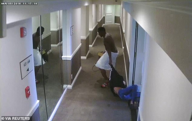 Sean "Diddy" Combs drags ex-girlfriend Casandra "Cassie" Ventura in a still image from a March 5, 2016 surveillance video taken in the hallway of a Los Angeles hotel, where a towel-clad Combs threw Ventura to the ground and began to kick her, which was entered as evidence in New York sex trafficking trial