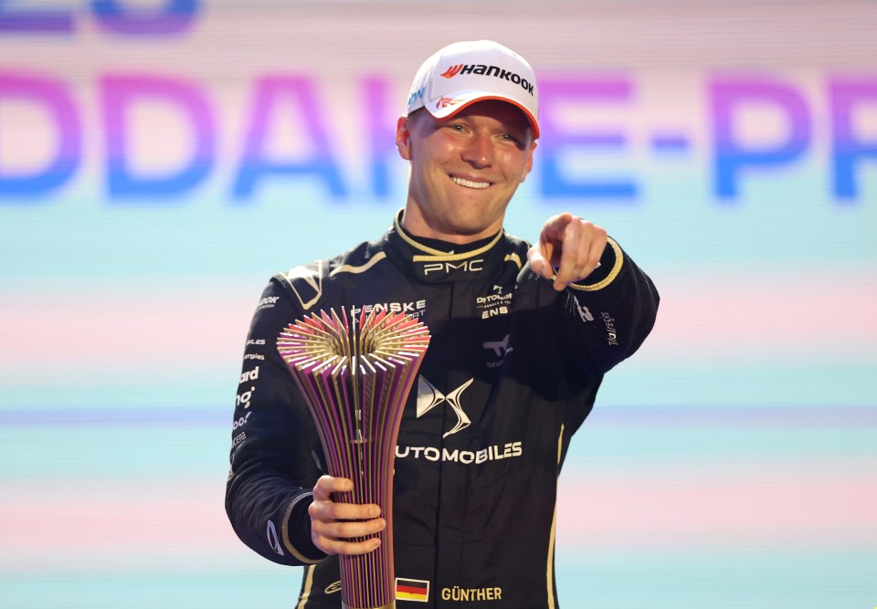 Maximilian Gunther holding a trophy and pointing.