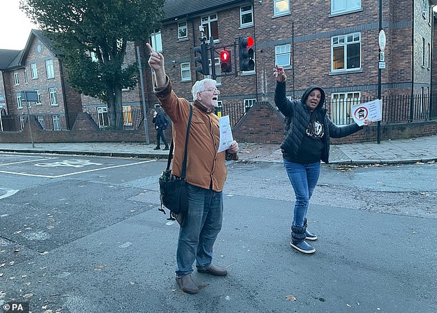 This picture from November 1 shows volunteers protesting against Lambeth Council's Streatham Wells LTN - and warning motorists against driving down the road