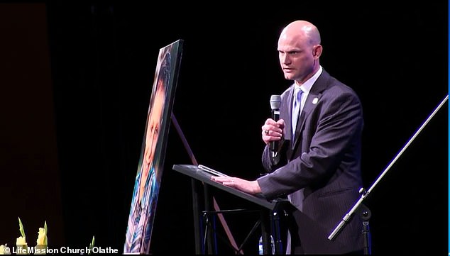 Mr Schwab - who now serves as Kansas Secretary of State - kissed Caleb’s portrait before making his way off the stage
