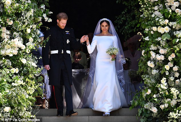 Meghan added a personal touch, stitching a piece of blue gingham fabric from the dress she wore on her first date with Harry in the hem