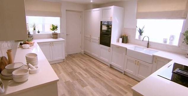 The DIY SOS team also laid the 'hideous fake wooden flooring' in the families kitchen area