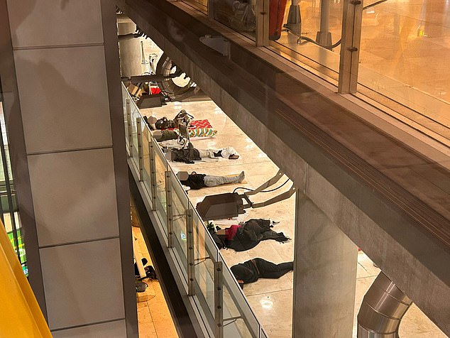 One tourist was overheard saying Terminal 4 was like a 'disaster zone' as one 'occupant' revealed some people had been living here 'for years'