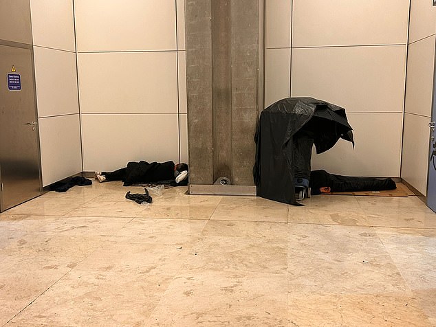 The ¿occupants¿ are seen sleeping on every level of the terminal and in any spot they can find