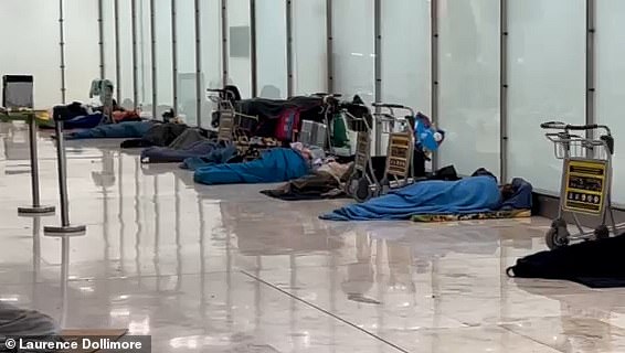 Up to a dozen officers from the National Police were seen checking people's papers along the 'main street' of the 'homeless city', which runs across a hallway by the elevators on the first floor