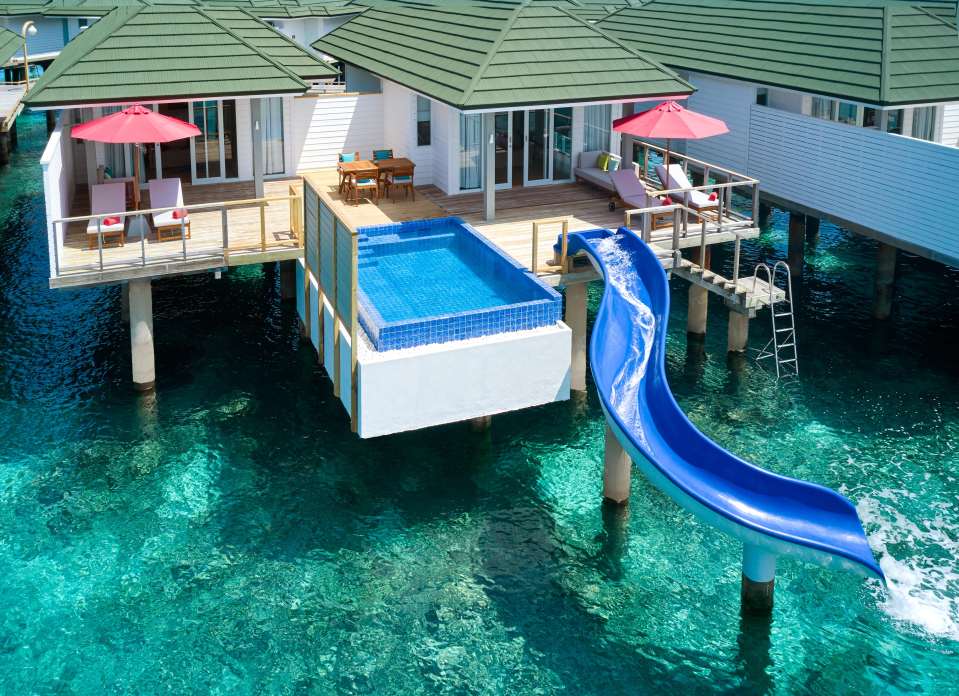 Overwater bungalow with private pool and waterslide.