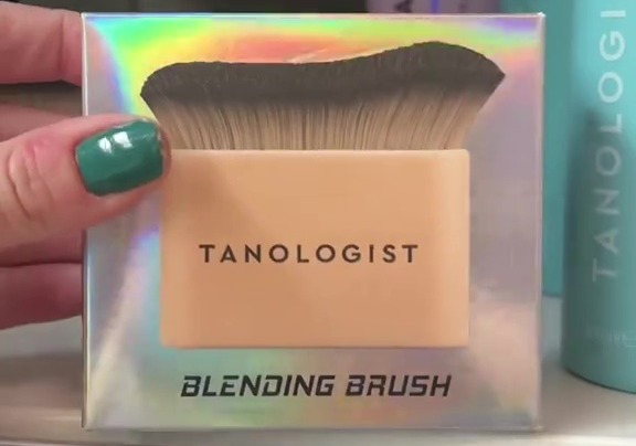 Tanologist blending brush in a supermarket.