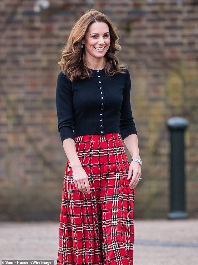 Kate Middleton looked warm in her Brora cardigan as she attended a party for families of military personnel deployed in Cyprus in 2018