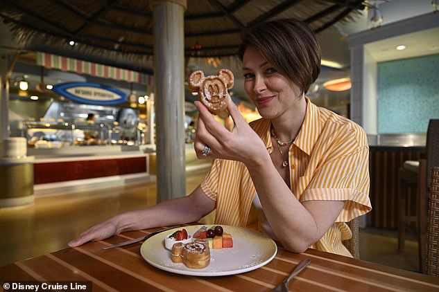 Emma says: 'There are Mickey waffles every single morning on the buffet [pictured], and when you go to the coffee shop, the coffee art is always a different Disney character'