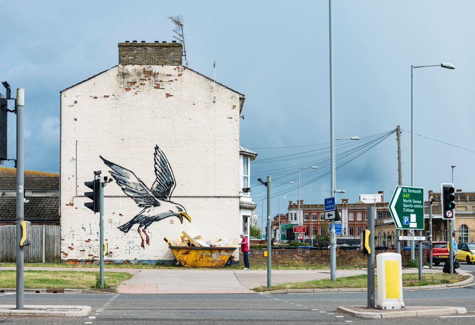 Banksy mural of a seagull on a building wall.