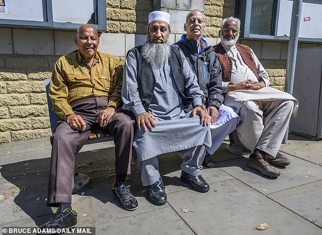 Four pensioners of Pakistani origin sat on a bench in the afternoon sunshine and echoed some of the concerns raised by fellow residents of the town. Pictured: Mohammed Shafi, Basharat Ahmed, Mughal Sahib and Mohammed Yusuf in Nelson town centre