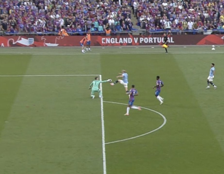 Soccer game, England vs Portugal.  A goalkeeper makes a save.