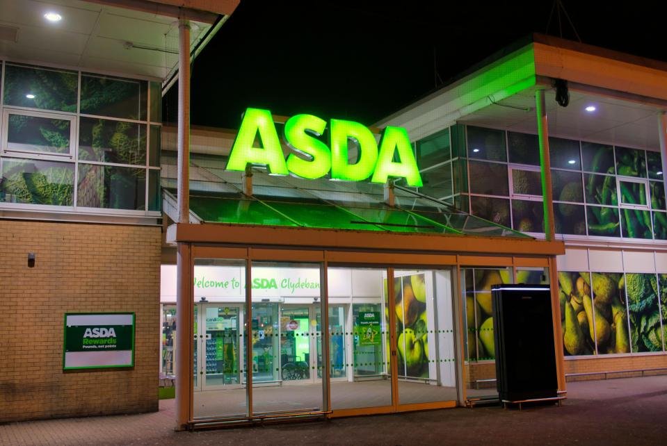 ASDA supermarket entrance at night.