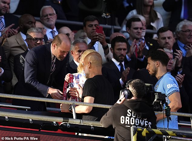Guardiola walked past the fan following the abusive comment to collect his runners-up medal