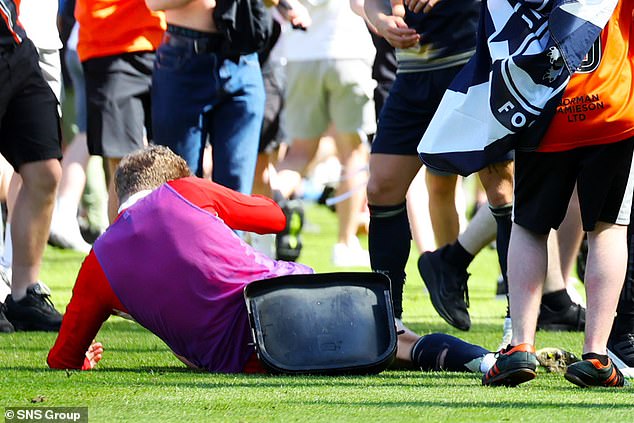 The object, believed to be part of a seat, knocked him to the ground in a shocking incident