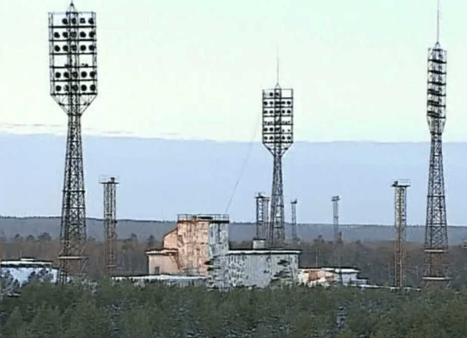 Launch complex with tall lighting towers.