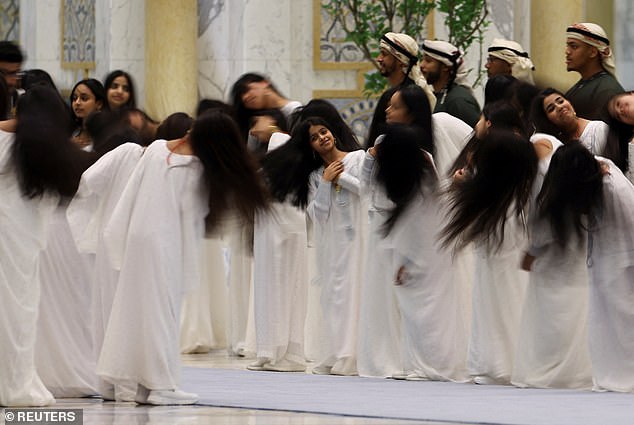 The president was delighted by children who performed the 'Al-Ayyala' hair flip as he was greeted by UAE President Sheikh Mohamed bin Zayed Al Nahyan, at Qasr Al Watan, in Abu Dhabi Thursday night for a state visit