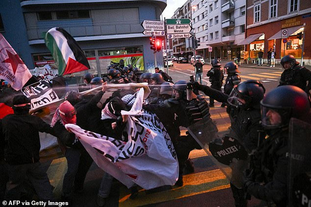 Pro-Palestine protesters clashed with Swiss riot cops as the show went on. Three have been detained after trying to storm the stage during Israel's performance