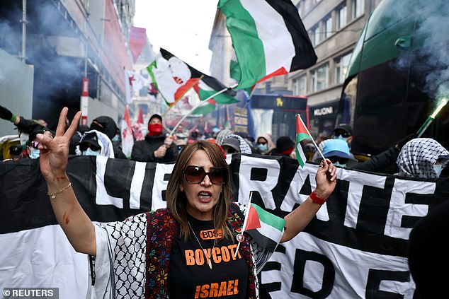A woman gestures as pro-Palestinian demonstrators attend a protest on the day of the Eurovision grand final