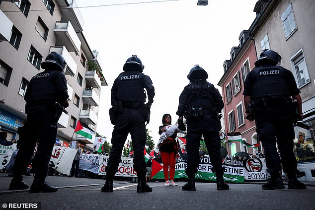 There is a heavy police presence in the area as the droves of Pro-Palestine supporters march through the Swiss city