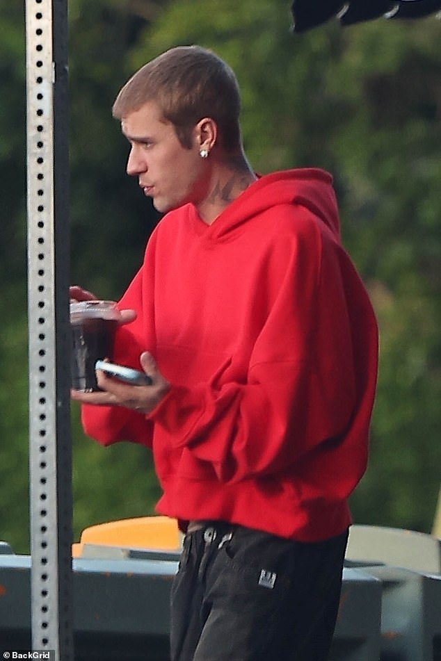 He carried a cellphone in his hand