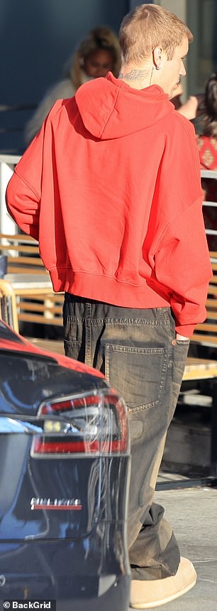 Even his friend's supportive presence was unable to wipe the careworn look from Justin's face as he grabbed an iced coffee from West Hollywood's Dialog Cafe