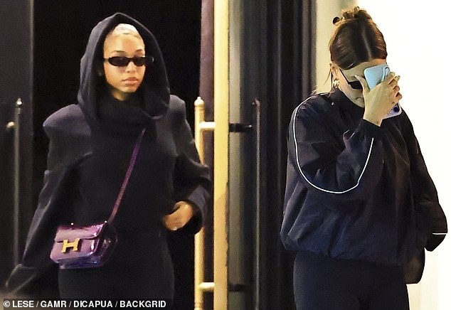 Hailey walked slightly ahead of Lori as they emerged from the restaurant
