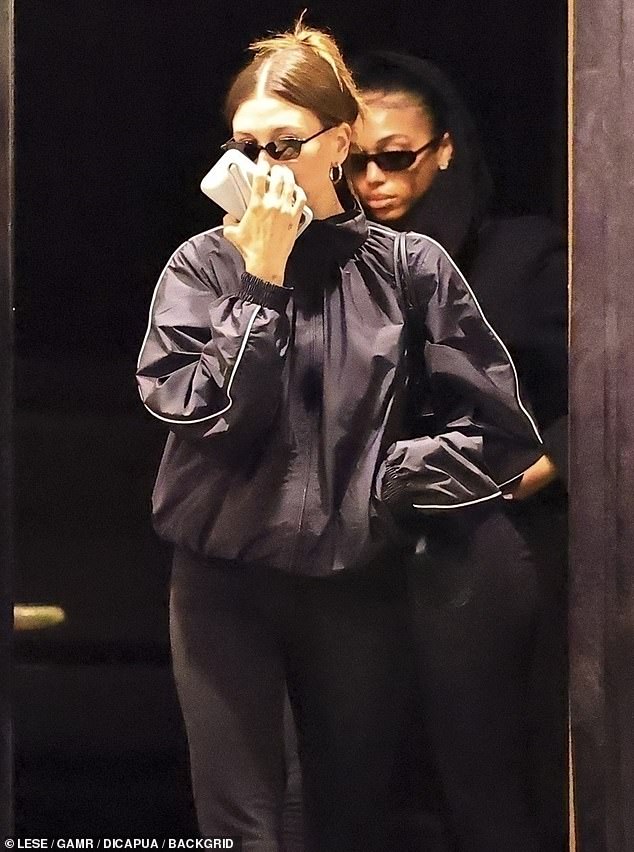 Meanwhile Hailey was glimpsed attempting to keep a low profile as she stepped out to dinner in nearby Beverly Hills with her friend and fellow 'nepo baby' Lori Harvey