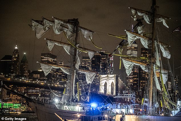 A disabled Mexican Navy tall ship floats between the Brooklyn and the Manhattan bridges on the East River. The ship struck the Brooklyn Bridge as it was traveling north