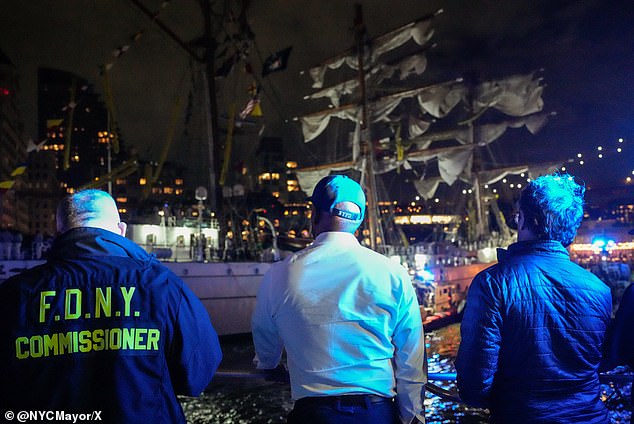 Mayor Adams was seen standing alongside representatives from the emergency services with the doomed ship seen in the background