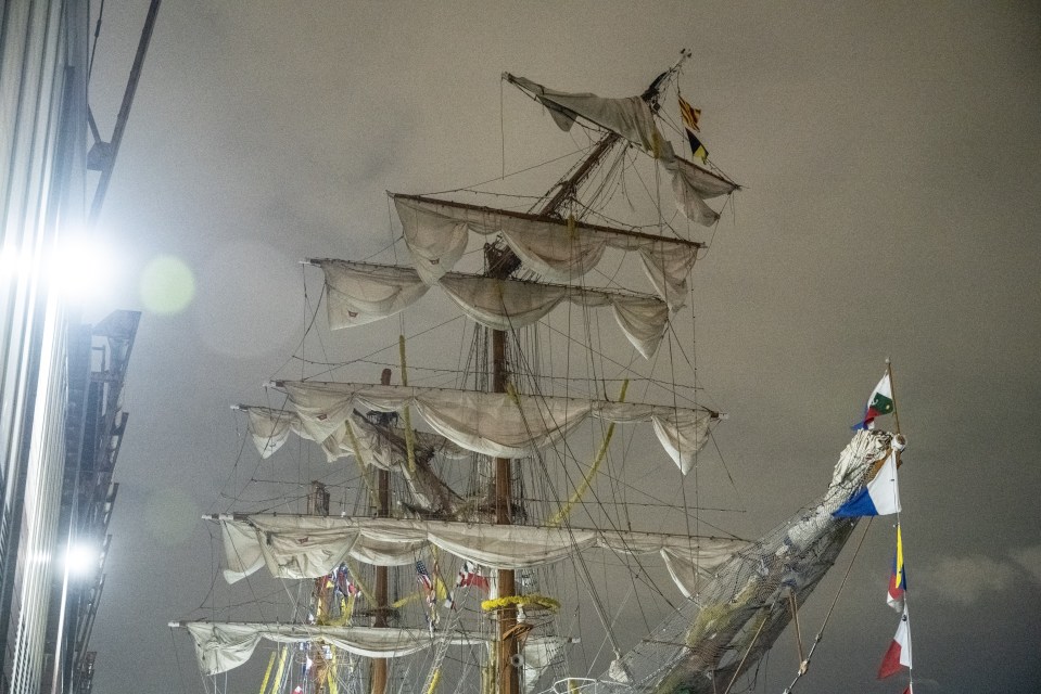 Damaged Mexican Navy tall ship at a pier.