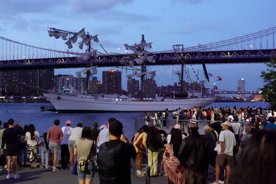 The Cuauhtemoc, a Mexican Navy training ship, in the East River under the Brooklyn Bridge.