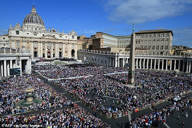 Pope Leo XIV greeting the crowd from the popemobile before a Holy mass for the beginning of his pontificate