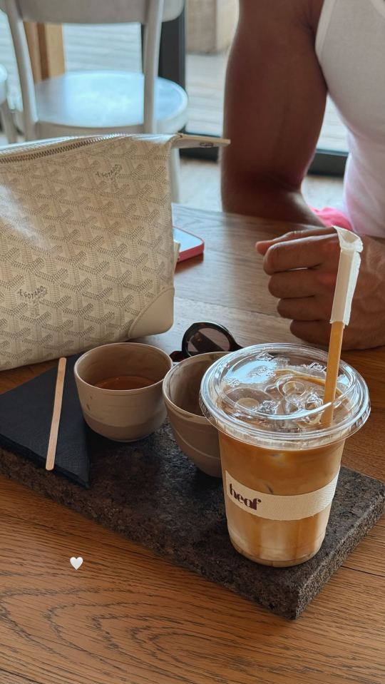 Iced coffee and espresso on a table.