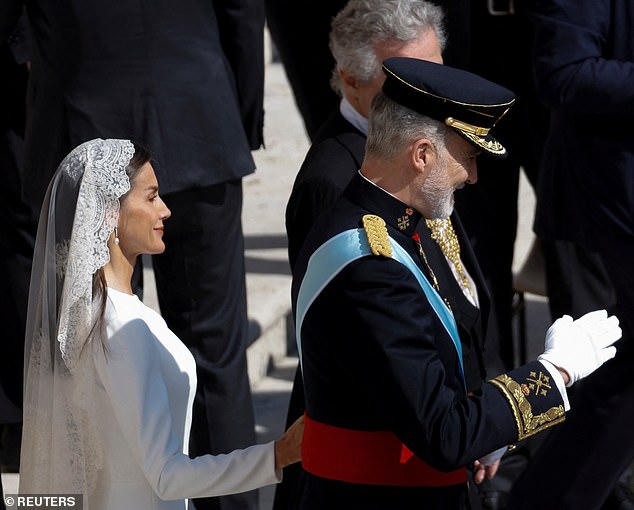 Spain's Queen Letizia and King Felipe smiled as they arrived at the historic inauguration mass today