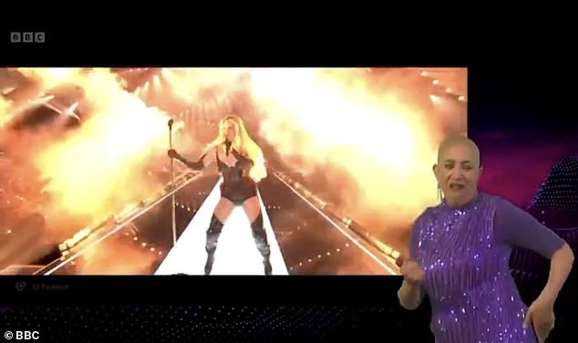Clad in a sparkly purple dress, the interpreter stood in the corner of the screen to transcribe the song into sign language for viewers with hearing difficulties