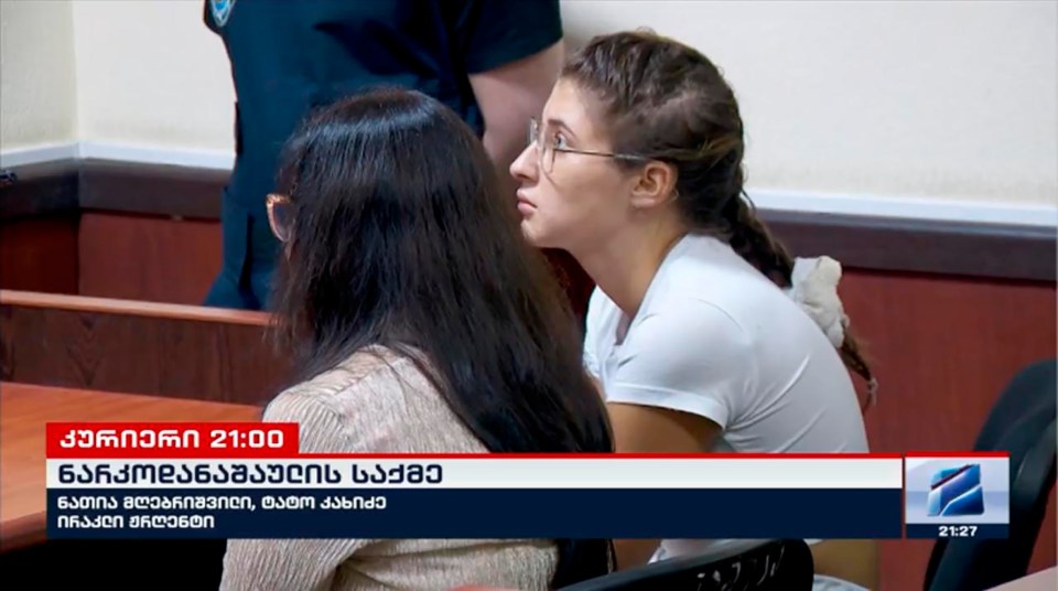 A young woman in court, suspected of drug smuggling.