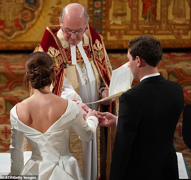 Eugenie's childhood operation resulted in a prominent scar, which she wore with pride, opting for a backless gown for her wedding to Jack Brooksbank in 2018 (pictured)
