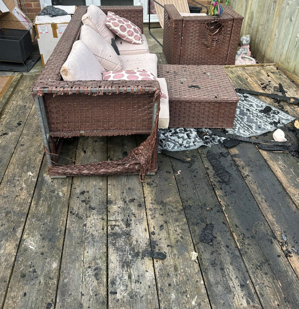 Fire damage to a woman's garden furniture and deck.