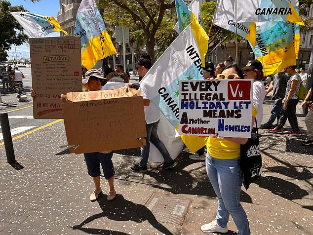 Scores of fed-up locals kicked off demonstrations across the archipelago from 11am, including in Tenerife, where thousands of Brits are currently holidaying