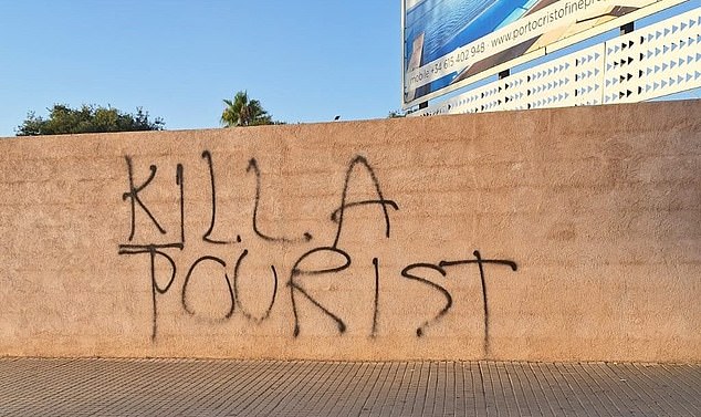 Anti-holidaymaker protests took a sinister turn last year as 'kill a tourist' graffiti appeared on a wall in Mallorca