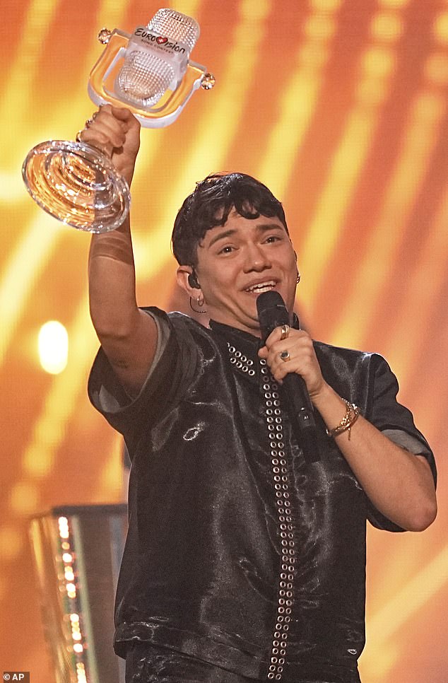 Eurovision winner JJ from Austria holds up the trophy. He won with the song Wasted Love