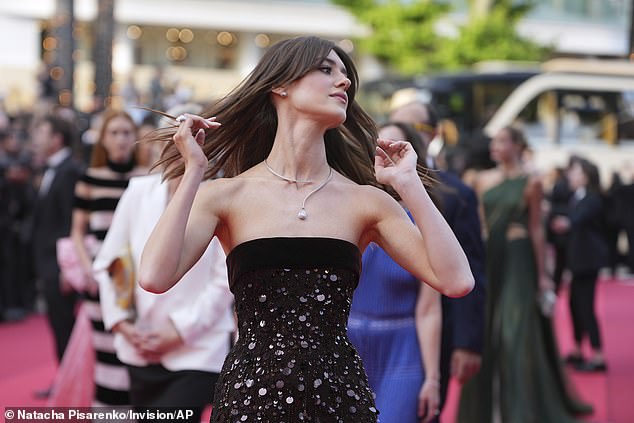 She posed up a storm for the cameras as she made her arrival to the red carpet