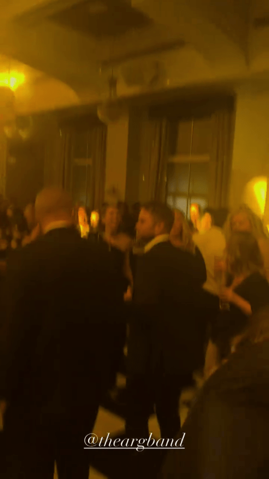 James Argent at a crowded indoor event.
