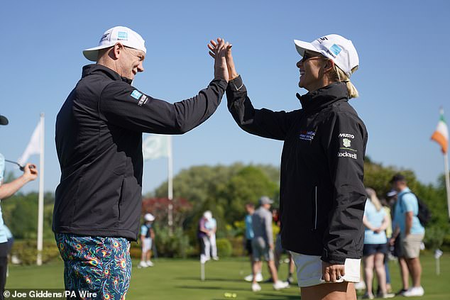 Mike and Zara high-five during the Mike Tindall Celebrity Golf Classic at the Belfry Golf & Resort Hotel in Sutton Coldfield